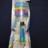 A toothbrush in colorful rainbow packaging.| Psilocybin Myco
